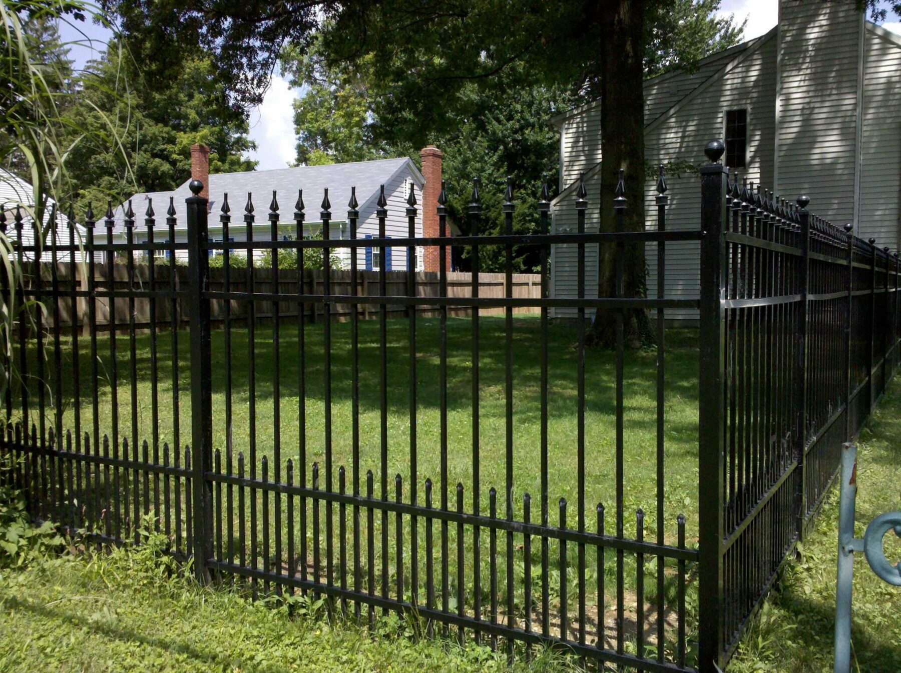 Install a black aluminum fence with puppy pickets in Indianapolis